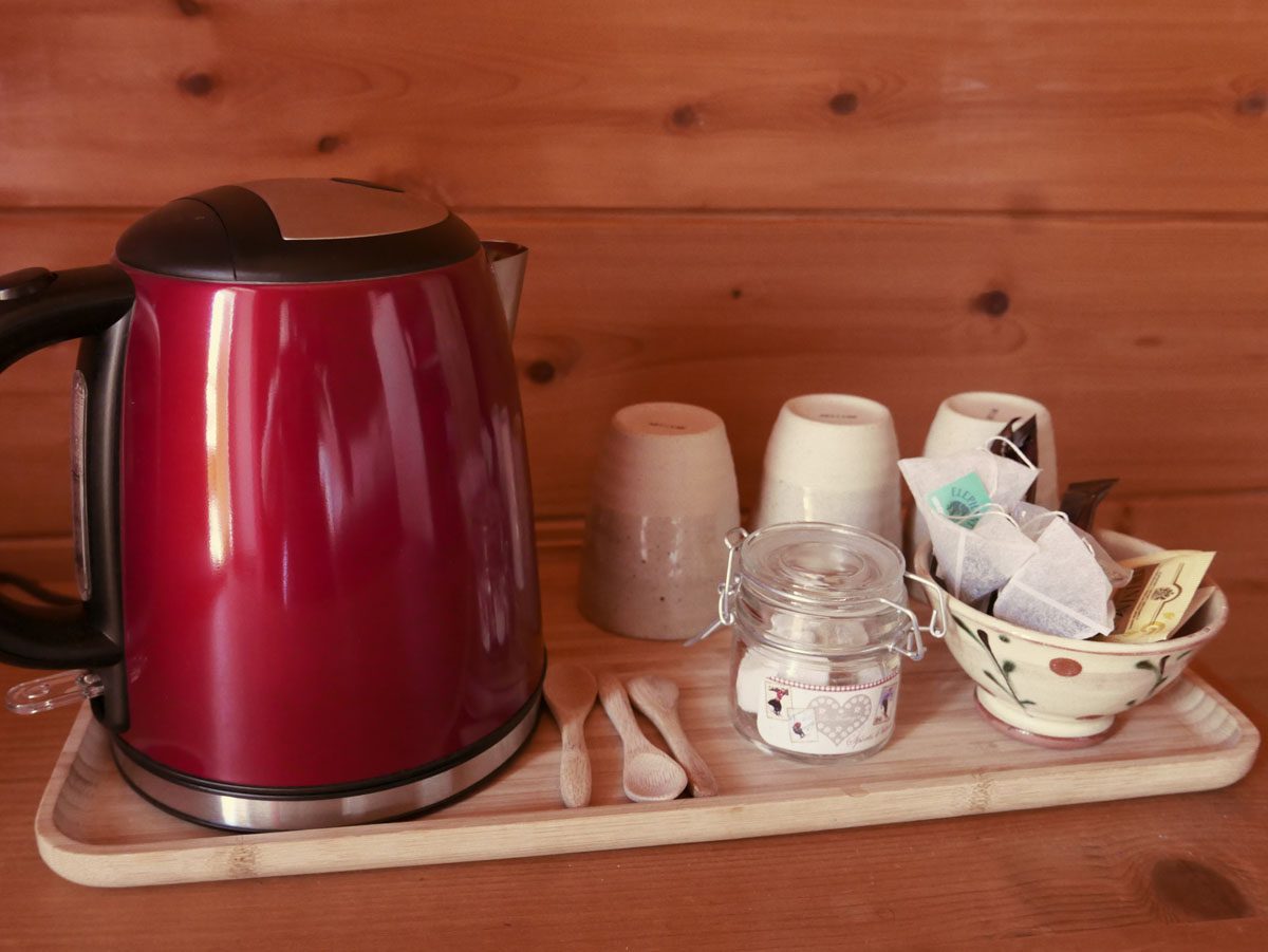 Kettle and cups of the tea and coffee set